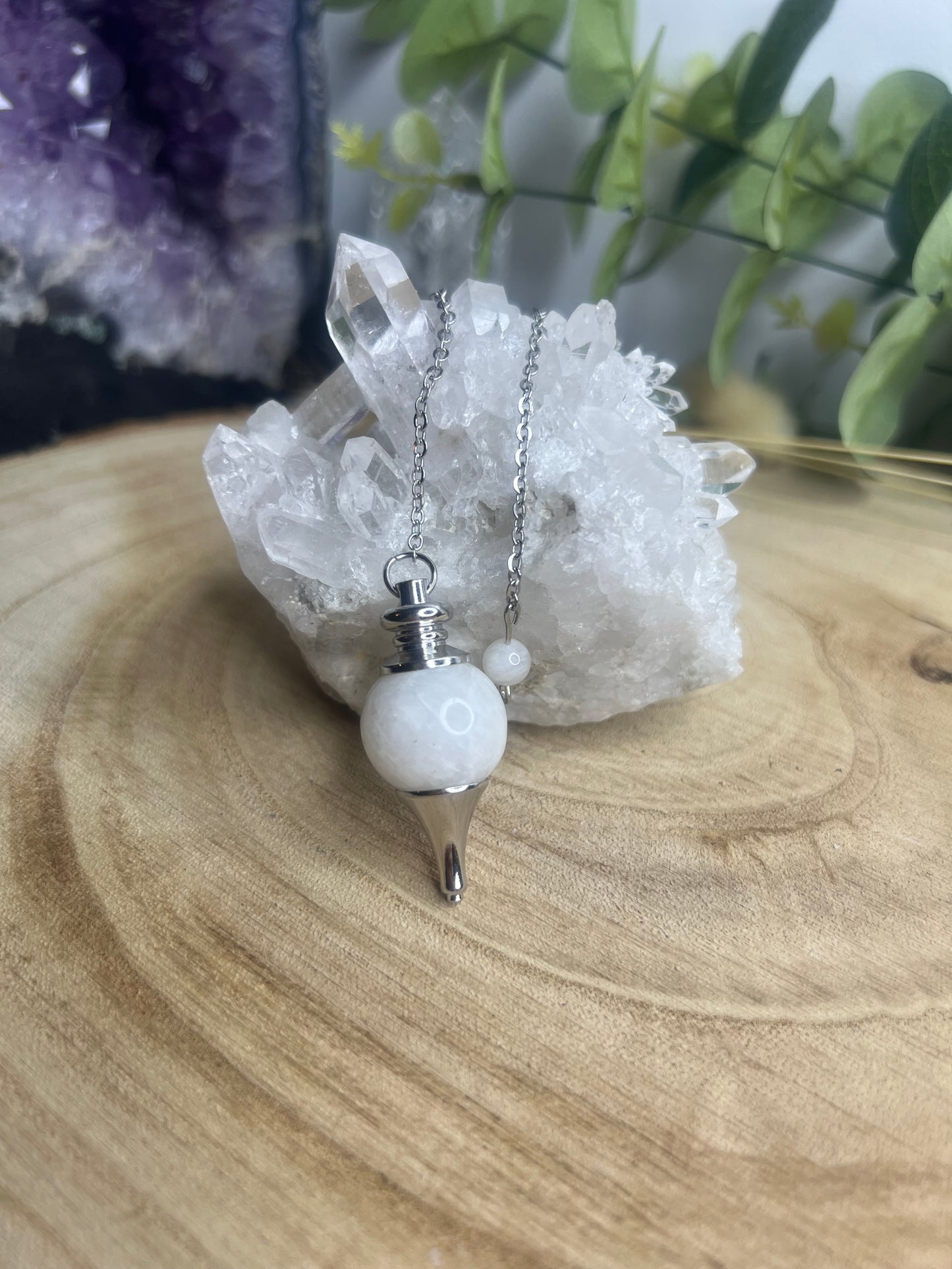 Pendule sphère Pierre de Lune Blanche